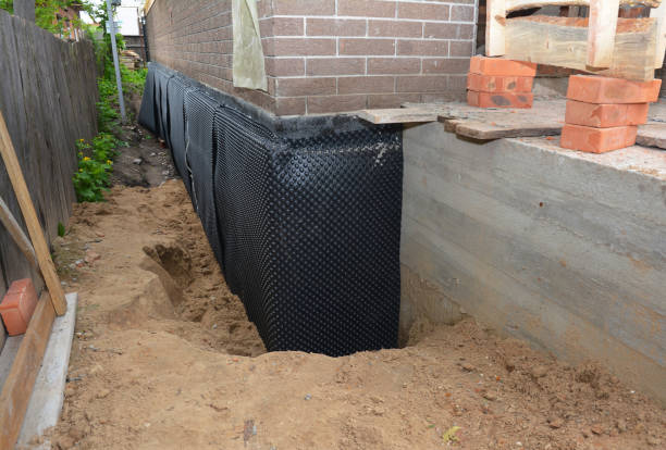 Happy homeowners after waterproofing job in Helmetta
